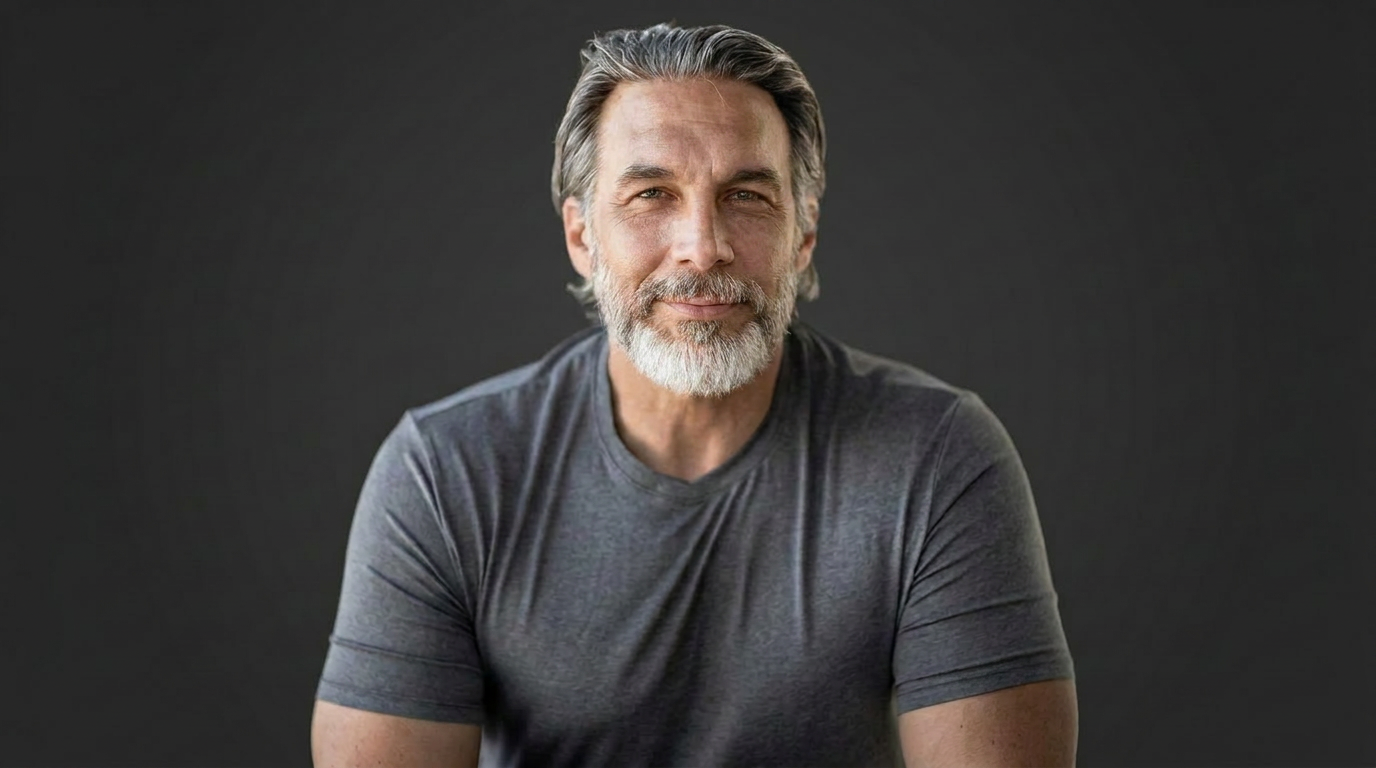 Troy Vanderhule smiling in a charcoal T-shirt